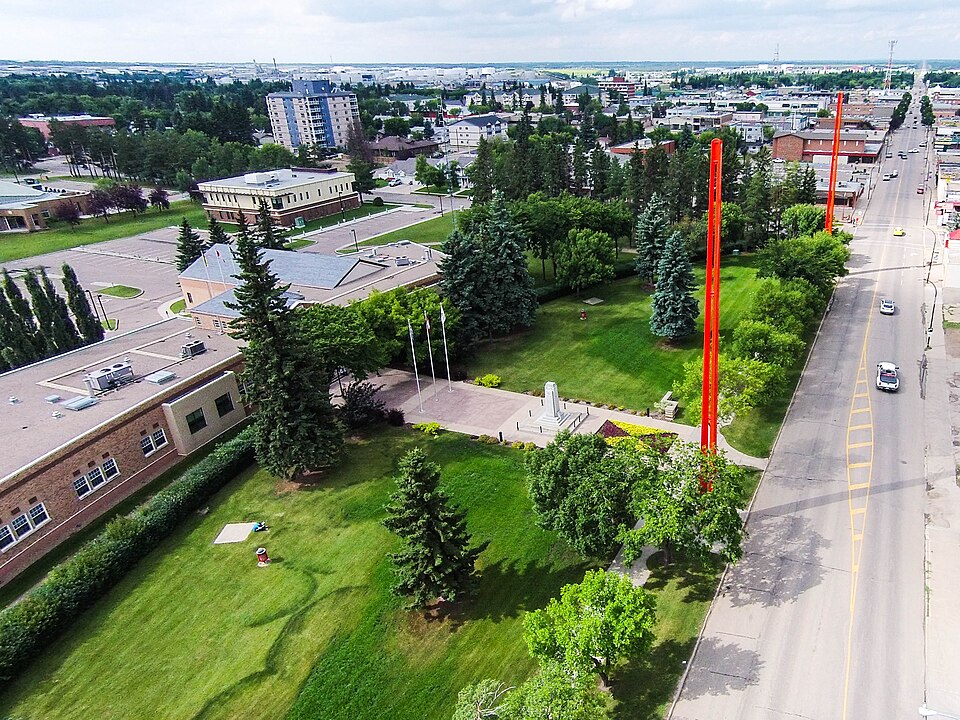 erial view of Lloydminster City Hall and downtown with red border markers highlighting the Alberta–Saskatchewan provincial boundary